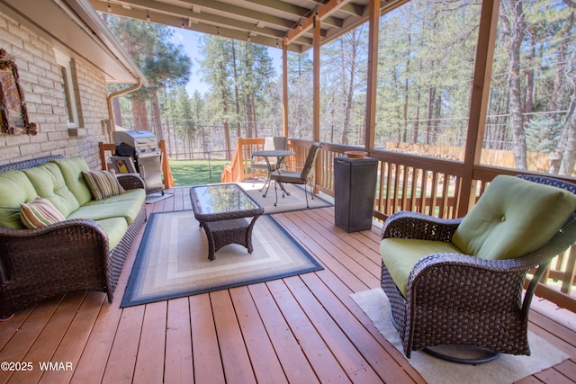 deck featuring grilling area and outdoor lounge area