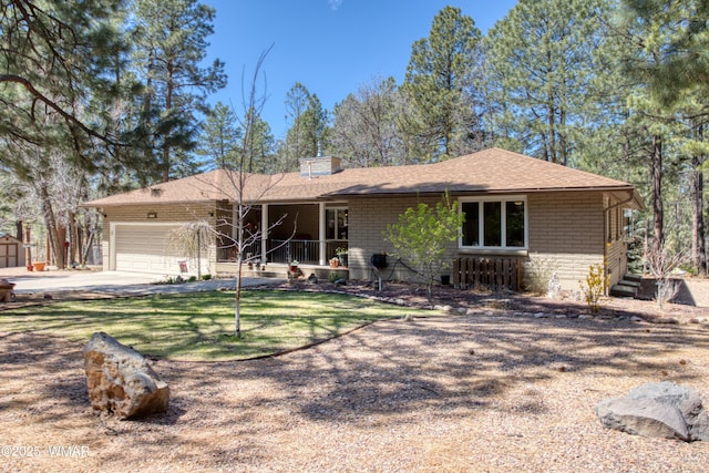 ranch-style home with driveway, a shingled roof, and a garage