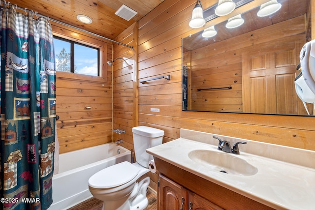 full bathroom featuring visible vents, toilet, wood walls, vanity, and wooden ceiling