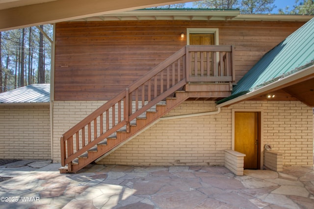 2761 Blue Lupine Ln, Pinetop, AZ 85935 - entrance to property with metal roof, a patio, and brick siding