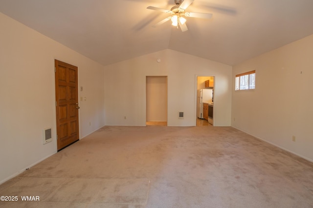 2761 Blue Lupine Ln, Pinetop, AZ 85935 - unfurnished bedroom with freestanding refrigerator, lofted ceiling, ensuite bathroom, light colored carpet, and visible vents