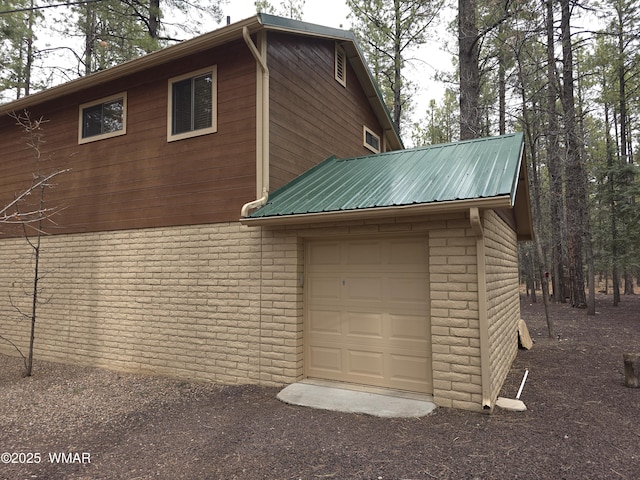 2761 Blue Lupine Ln, Pinetop, AZ 85935 - exterior space with metal roof, a garage, and brick siding