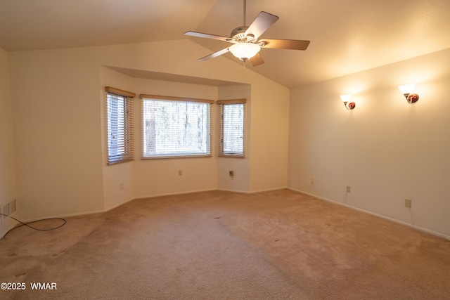 2761 Blue Lupine Ln, Pinetop, AZ 85935 - spare room featuring light carpet, baseboards, lofted ceiling, and a ceiling fan