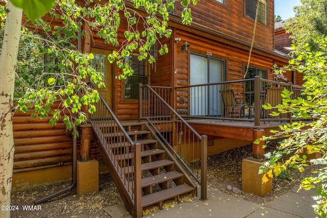 exterior space with log veneer siding
