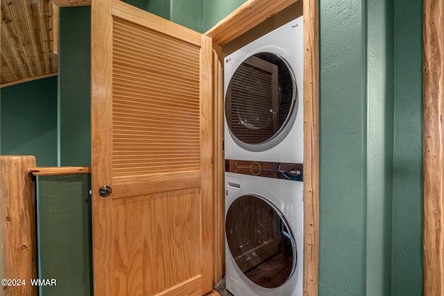 laundry area with stacked washing maching and dryer and laundry area