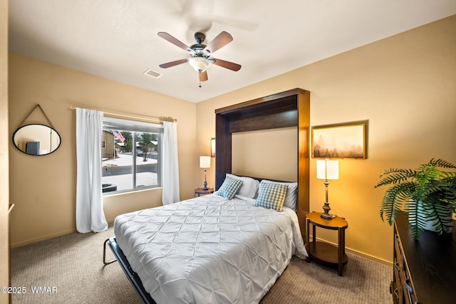 carpeted bedroom featuring visible vents, ceiling fan, and baseboards