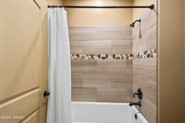 bathroom with shower / bath combination with curtain