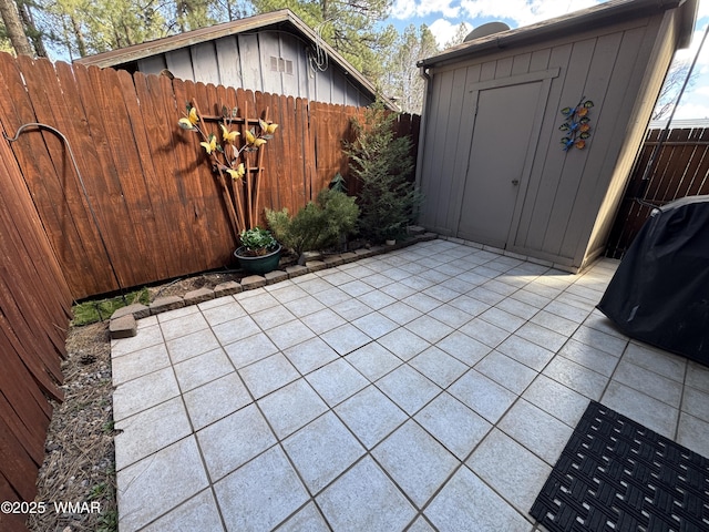 view of shed featuring a fenced backyard