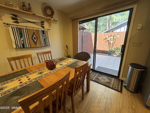 dining area with light wood-style flooring