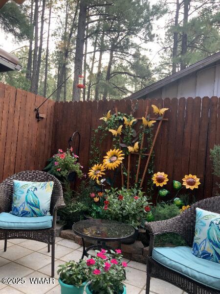 view of patio / terrace featuring fence