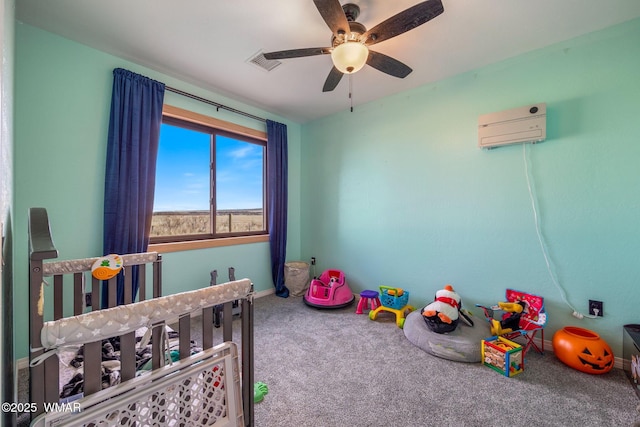 carpeted bedroom featuring a ceiling fan, visible vents, and a wall mounted AC