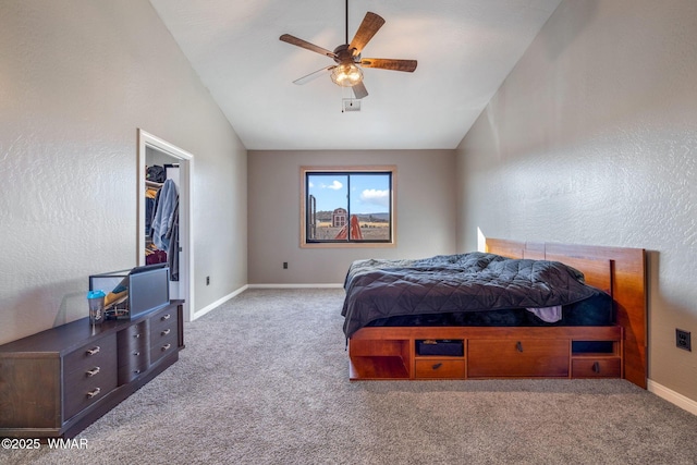 carpeted bedroom featuring lofted ceiling, ceiling fan, and baseboards