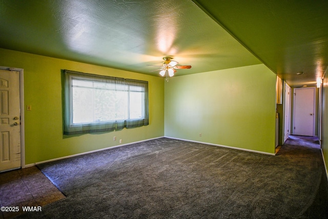 260 E 1st St, Snowflake, AZ 85937 - empty room featuring a ceiling fan and dark carpet