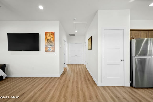 hall featuring attic access, recessed lighting, light wood-style floors, and baseboards