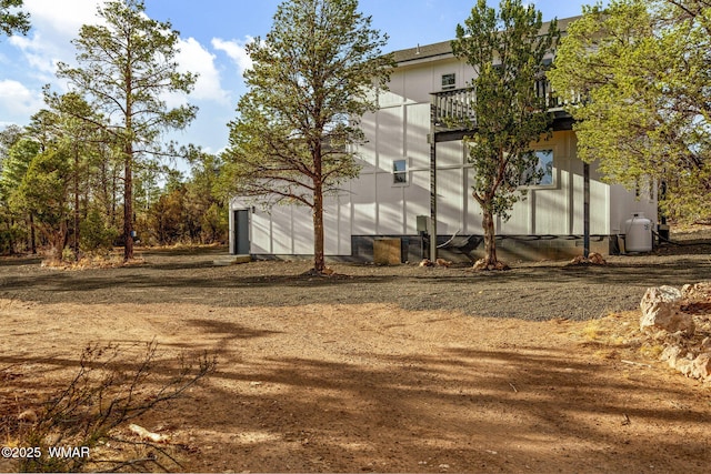 back of property with a balcony