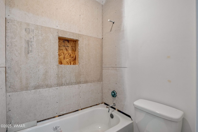 bathroom with toilet and a tub to relax in