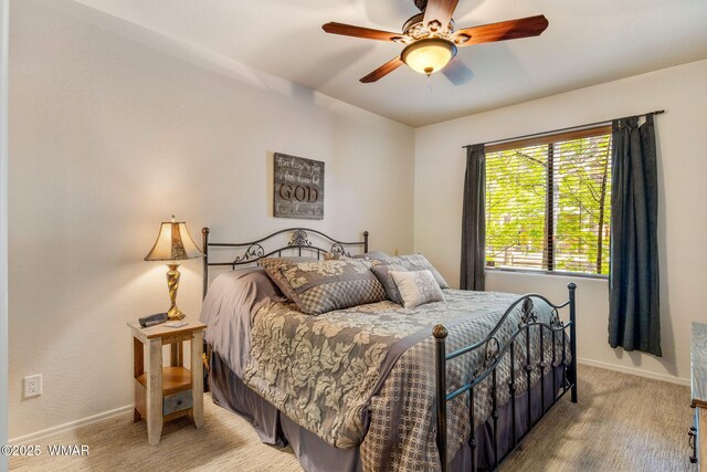 4186 Stone Pine Dr, Pinetop, AZ 85935 - bedroom with baseboards, a ceiling fan, and light carpet