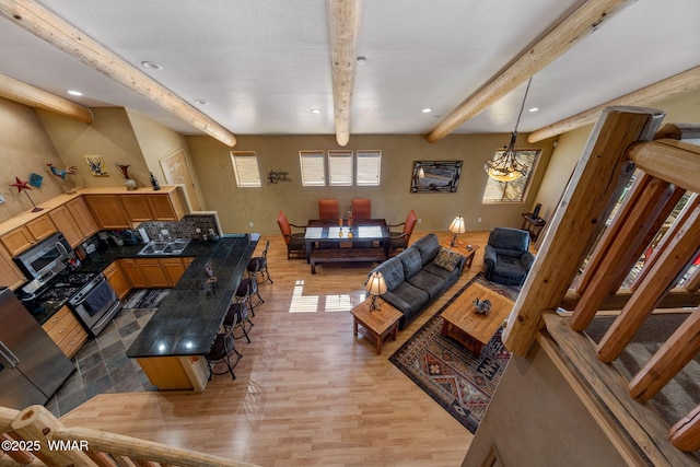 4186 Stone Pine Dr, Pinetop, AZ 85935 - living area featuring light wood-style flooring, beamed ceiling, and recessed lighting
