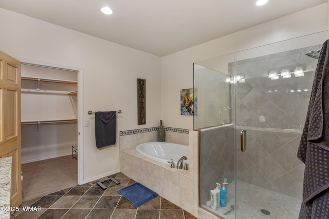 4186 Stone Pine Dr, Pinetop, AZ 85935 - bathroom featuring a bath, a shower stall, a spacious closet, recessed lighting, and baseboards