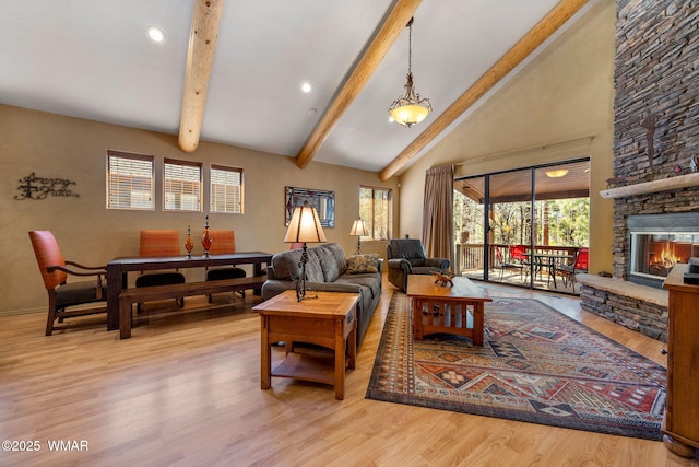 4186 Stone Pine Dr, Pinetop, AZ 85935 - living area featuring wood finished floors, healthy amount of natural light, recessed lighting, and a stone fireplace