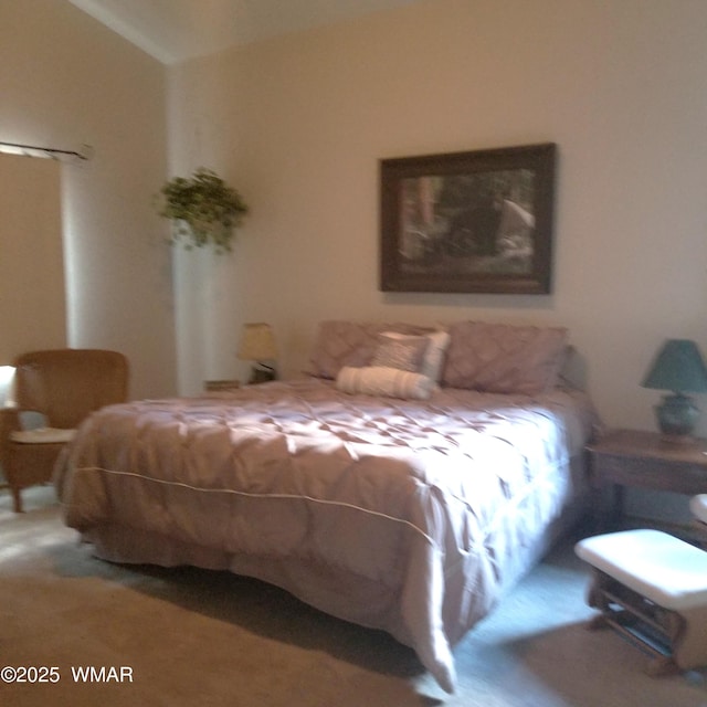 bedroom with lofted ceiling