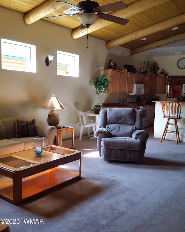 living area with beam ceiling, wooden ceiling, ceiling fan, and carpet flooring