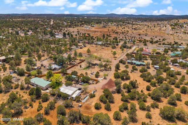 7124 Simons Way, Show Low, AZ 85901 - aerial view of property and surrounding area featuring rural landscape and a mountainous background