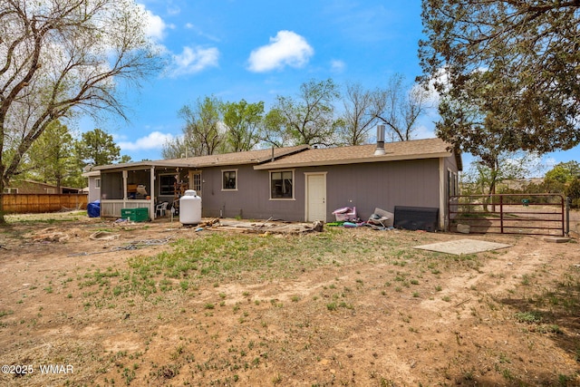 7124 Simons Way, Show Low, AZ 85901 - rear view of house featuring a sunroom, a fenced backyard, and roof with shingles