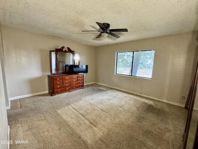 7124 Simons Way, Show Low, AZ 85901 - unfurnished bedroom with a textured ceiling, carpet, and a ceiling fan