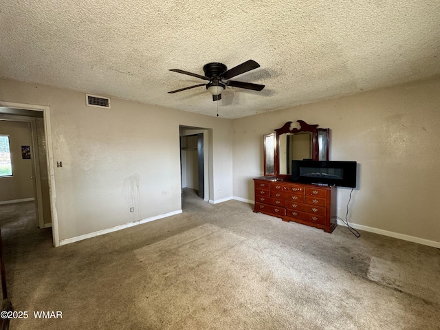 7124 Simons Way, Show Low, AZ 85901 - unfurnished living room featuring a ceiling fan, carpet flooring, and a textured ceiling