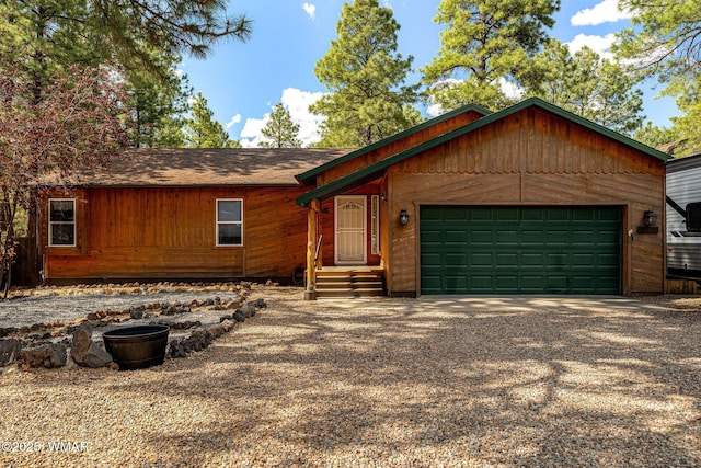 1720 W Huning, Show Low, AZ 85901 - rustic home featuring an attached garage, gravel driveway, roof with shingles, and entry steps