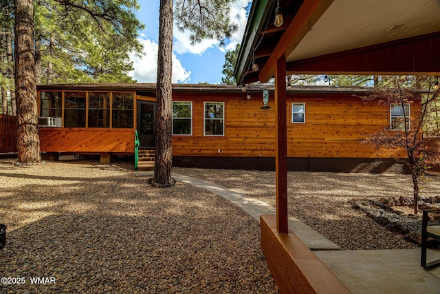 1720 W Huning, Show Low, AZ 85901 - view of side of property featuring a sunroom and entry steps