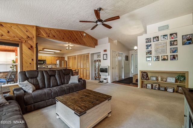 1720 W Huning, Show Low, AZ 85901 - living room with ceiling fan, vaulted ceiling, heating unit, and light colored carpet