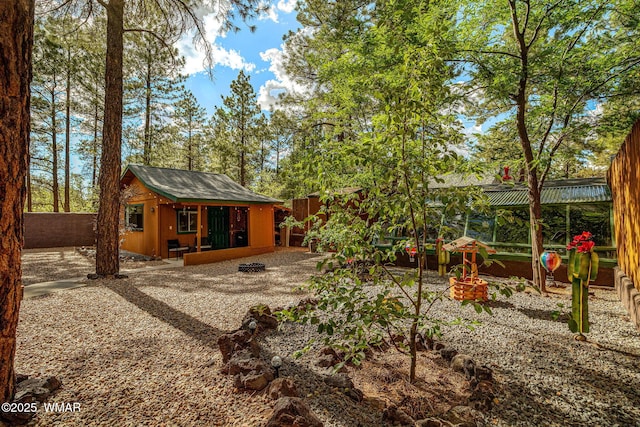 1720 W Huning, Show Low, AZ 85901 - back of property featuring a fenced backyard and an outdoor structure