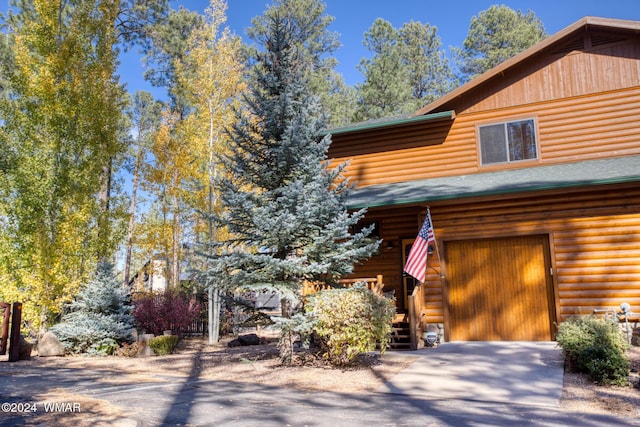 view of home's exterior featuring driveway