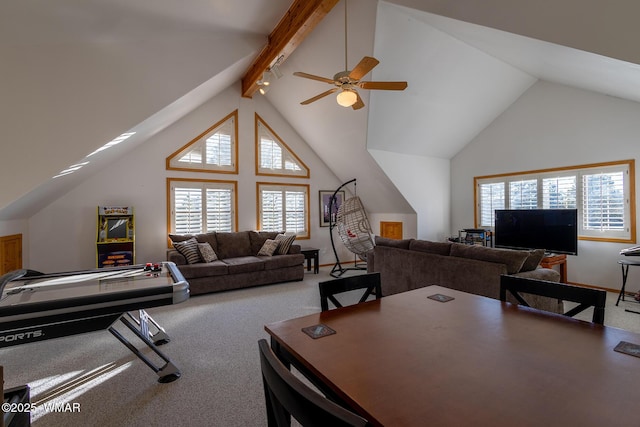 interior space with beam ceiling, a ceiling fan, and high vaulted ceiling