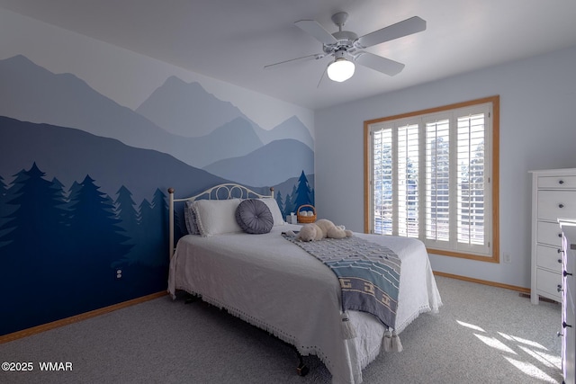 carpeted bedroom with baseboards and ceiling fan