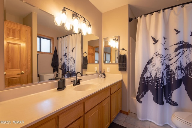 bathroom featuring tile patterned floors, toilet, and vanity