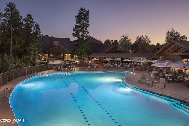 3440 W Black Oak Loop, Show Low, AZ 85901 - pool at dusk with a gazebo, a community pool, and a patio area