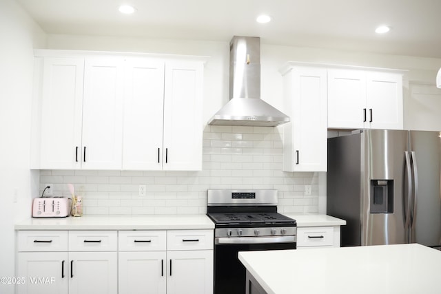 kitchen featuring wall chimney exhaust hood, decorative backsplash, light countertops, and stainless steel appliances