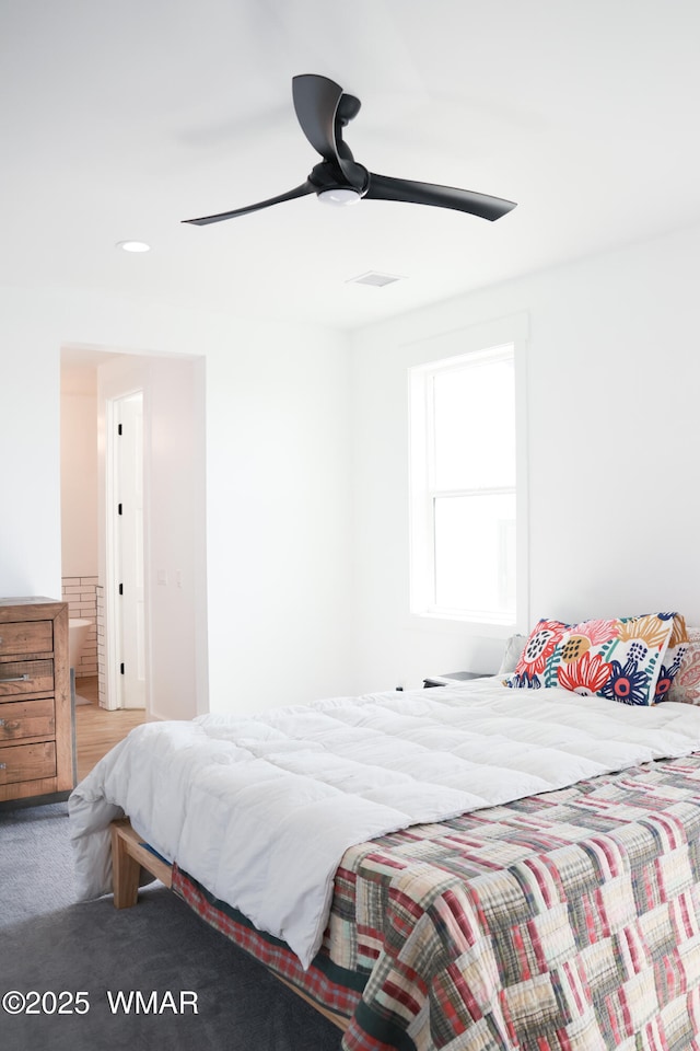 carpeted bedroom with a ceiling fan