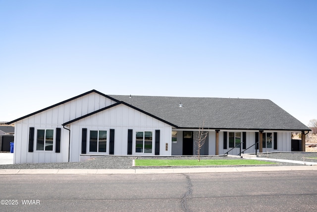 view of front of property featuring a shingled roof and board and batten siding