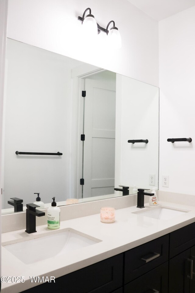 bathroom featuring double vanity and a sink