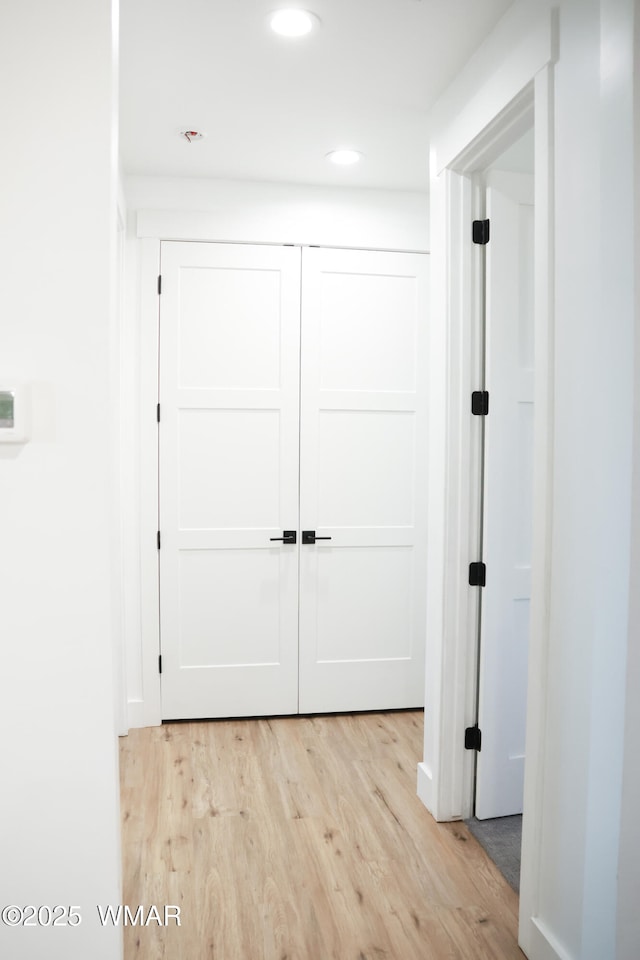 corridor with recessed lighting and light wood finished floors