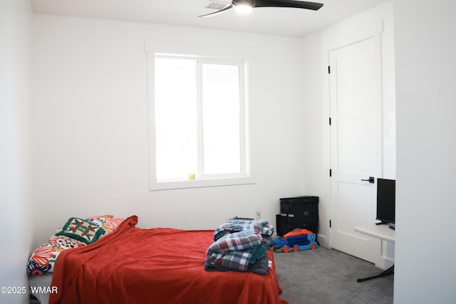 carpeted bedroom featuring a ceiling fan