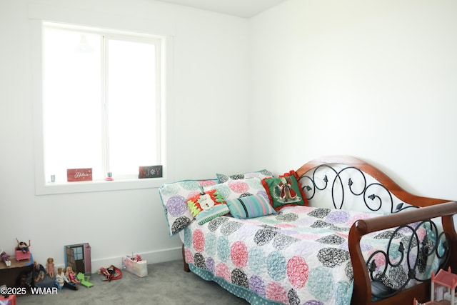 bedroom with multiple windows and carpet flooring