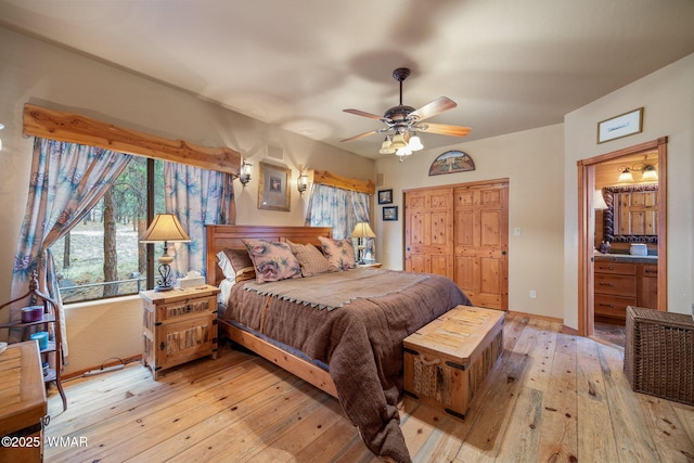 2353 Florian Meadow Trl, Overgaard, AZ 85933 - bedroom featuring light wood-style floors, a closet, and ceiling fan