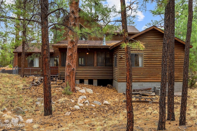 2353 Florian Meadow Trl, Overgaard, AZ 85933 - rear view of property featuring roof with shingles, a sunroom, faux log siding, and crawl space