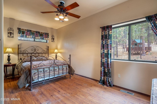 2353 Florian Meadow Trl, Overgaard, AZ 85933 - bedroom featuring wood finished floors and ceiling fan
