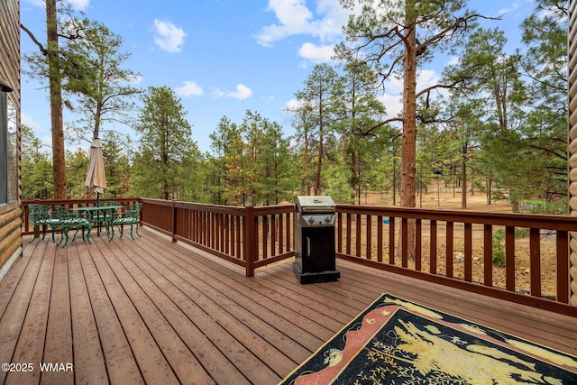 2353 Florian Meadow Trl, Overgaard, AZ 85933 - wooden deck with outdoor dining area and a grill